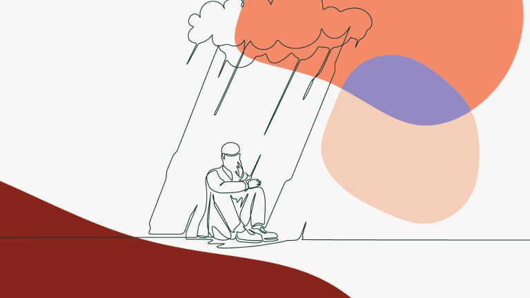 Two people sitting in the rain