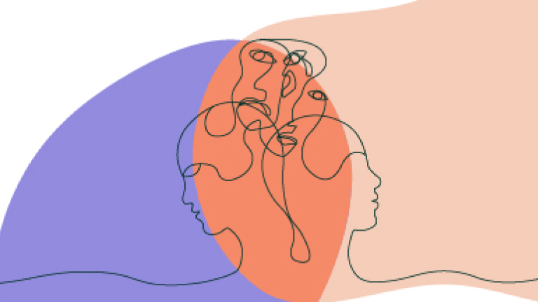 Two people sitting back to back